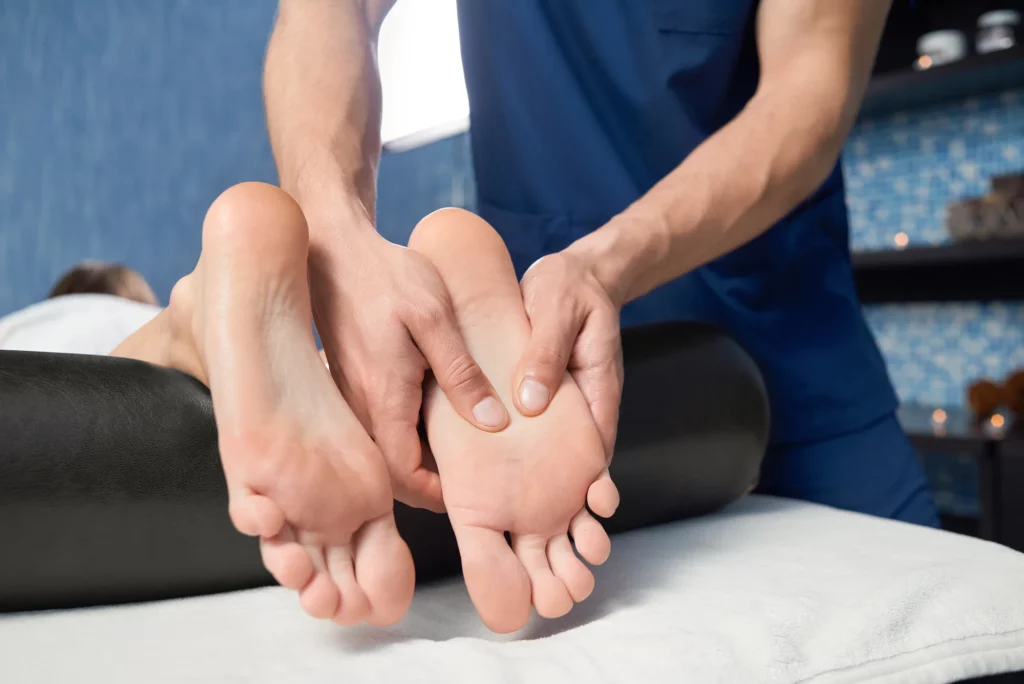 closeup of hands of masseur massaging foot of fema 2023 11 27 05 23 38 utc